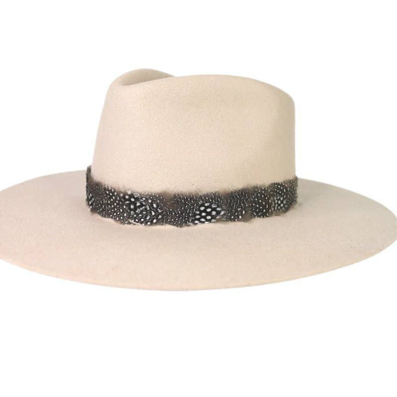 Cream-colored hat with a feather band.