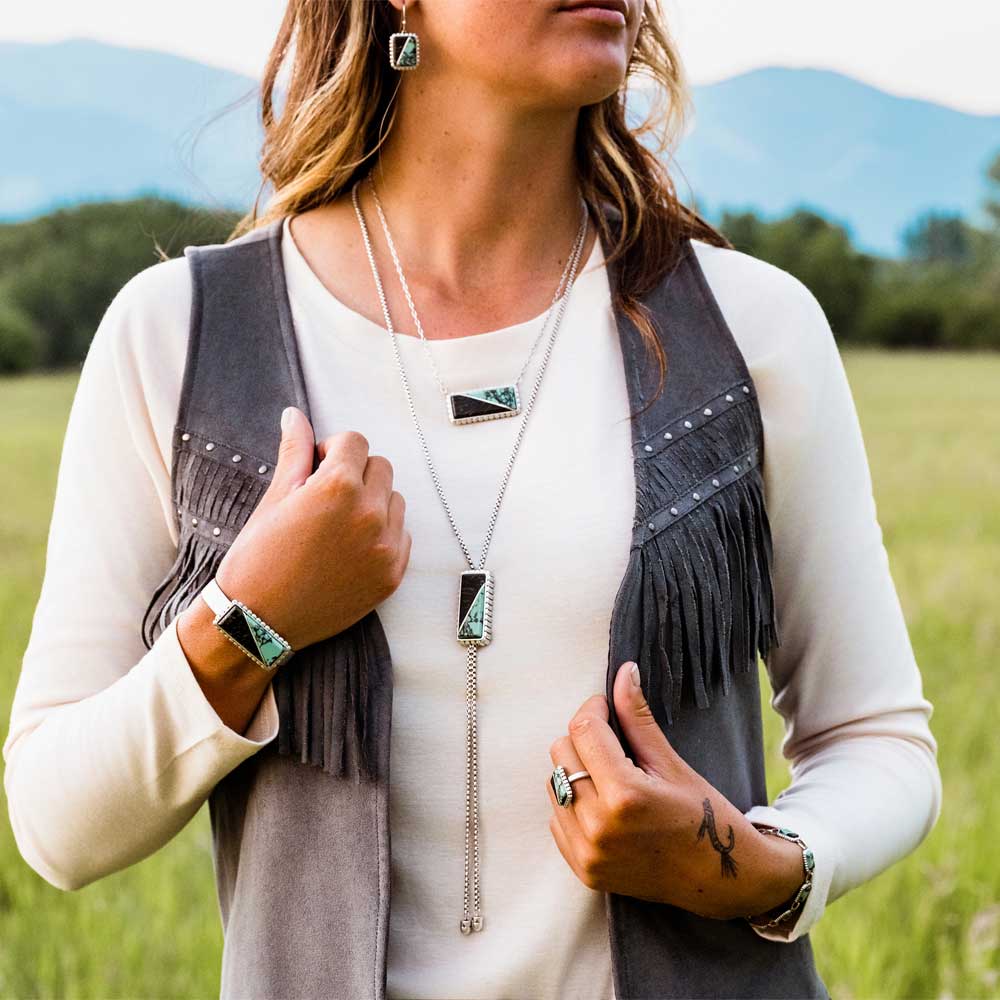 NC6011 jewelry set on woman in vest