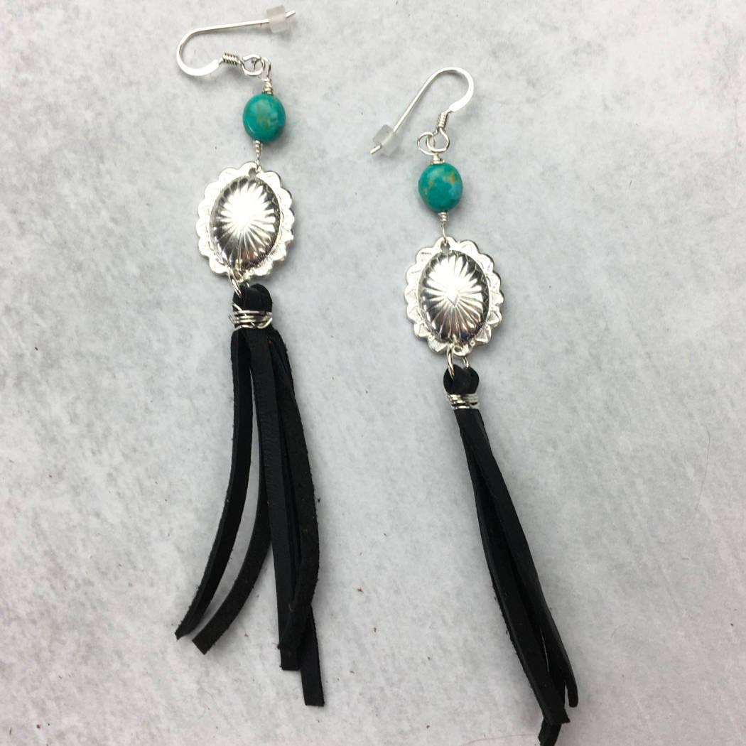Silver earrings with turquoise beads and black tassels.