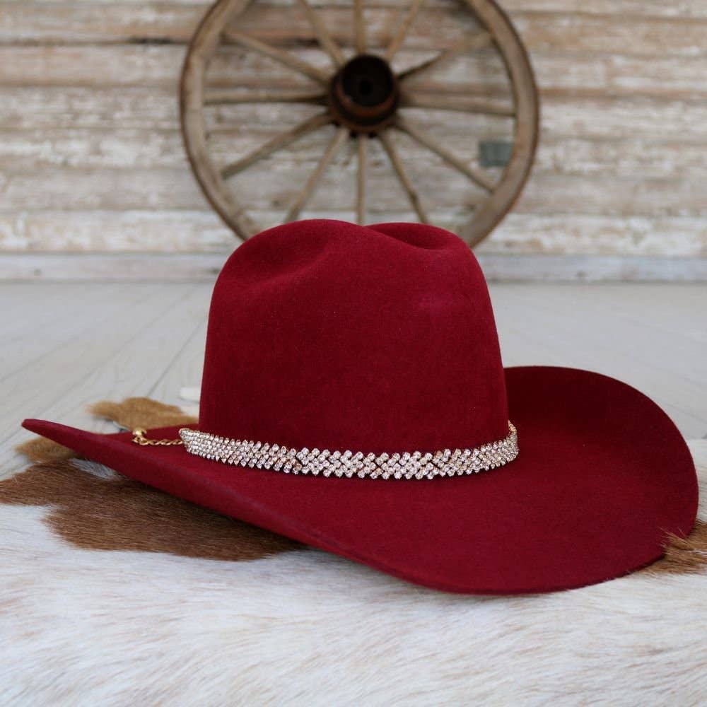 Red cowboy hat with jeweled band.