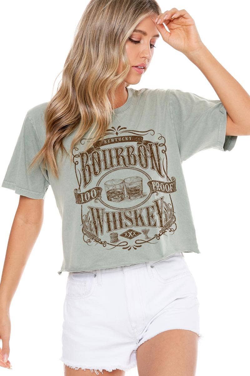 Woman in green t-shirt and white shorts.