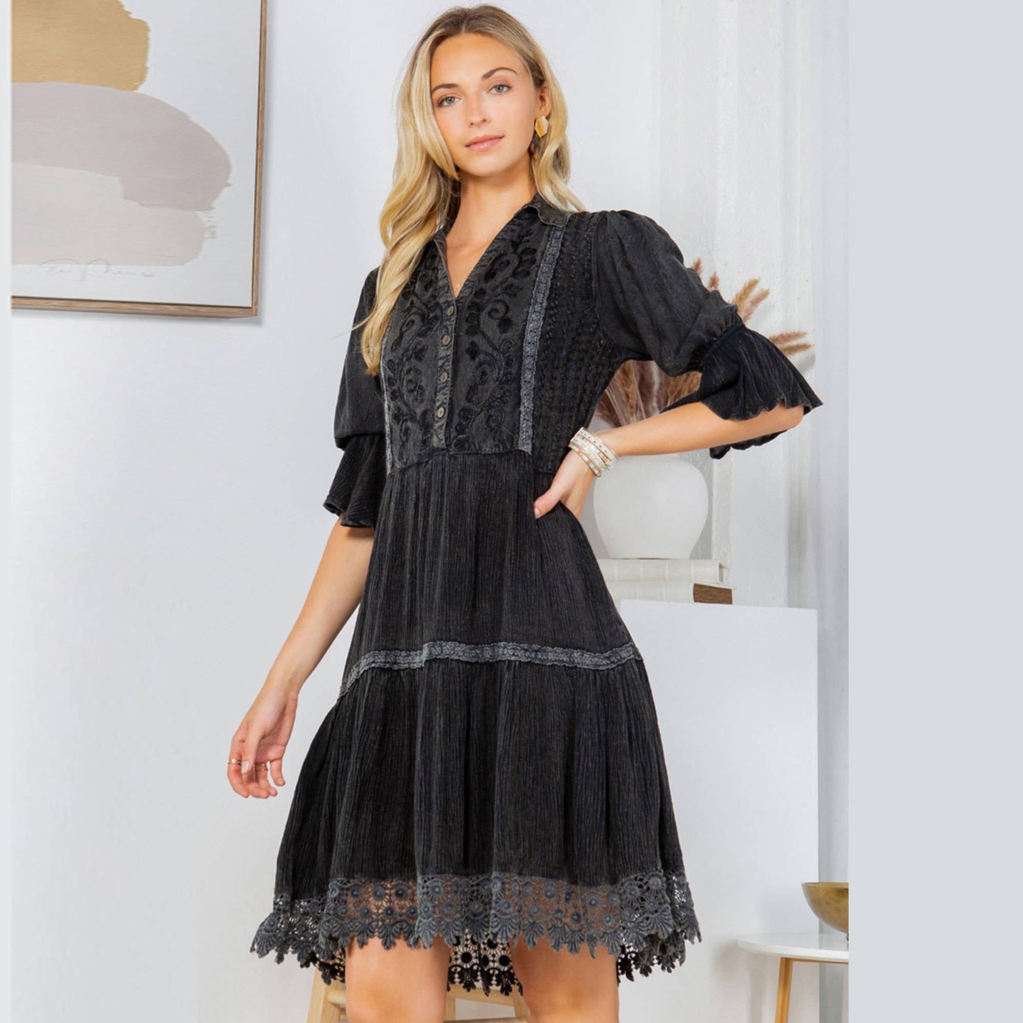 Woman wearing a black dress.