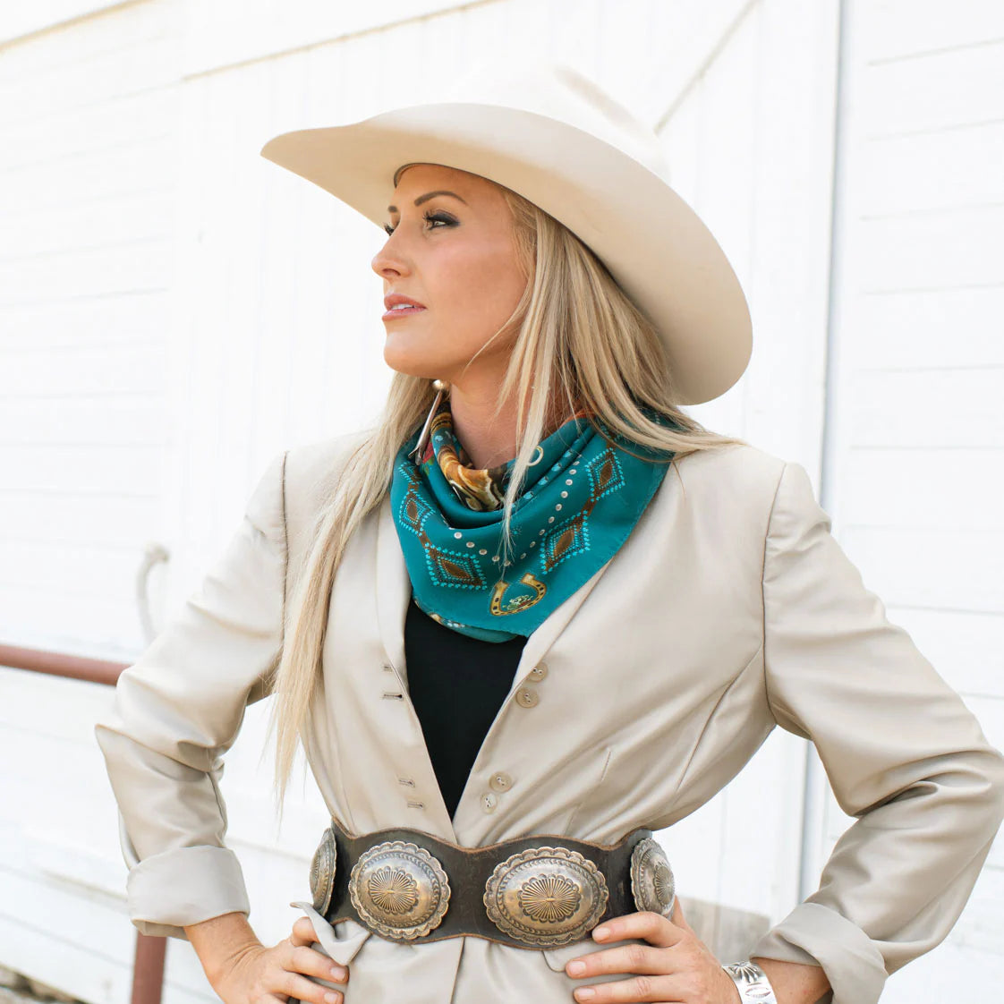 Woman in cowboy hat with jade wild rag scarf