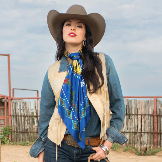 Cowgirl in royal blue wild rag scarf and fringe vest