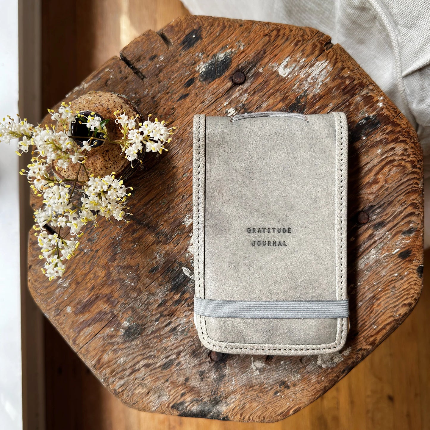Gratitude journal on wooden surface