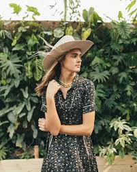 Woman in hat and floral dress, image 38.