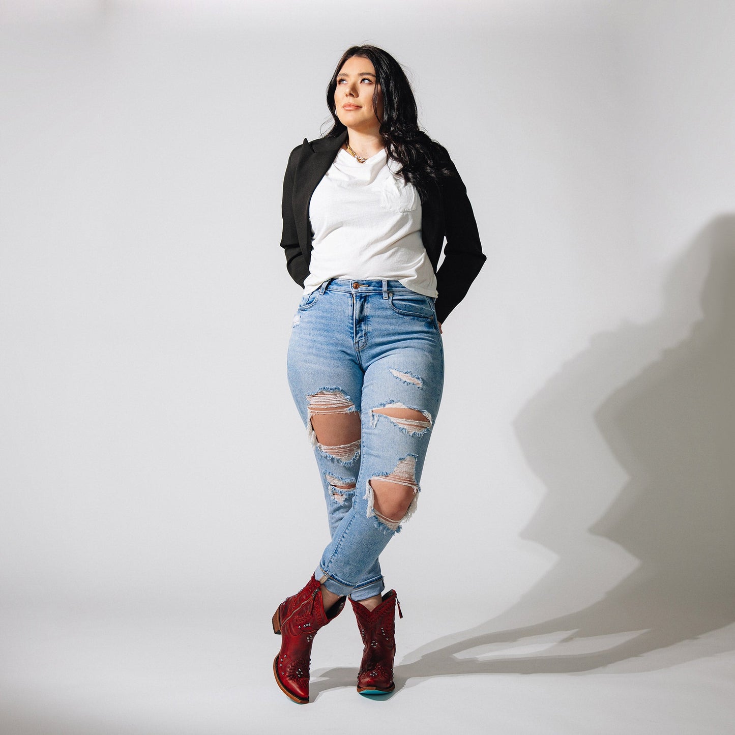 Woman in jeans & Smoldering Ruby Cossette Booties