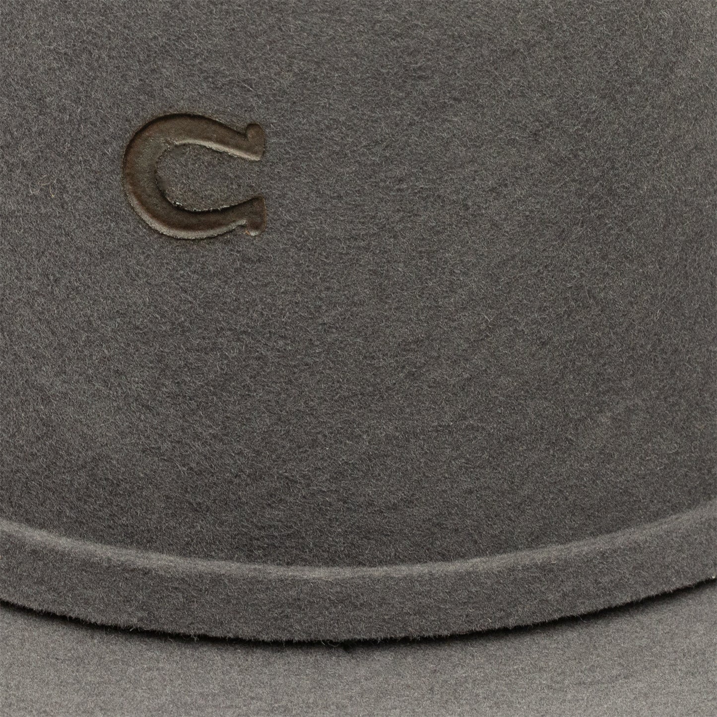 Close-up of gray hat with horseshoe logo, unnamed-273.