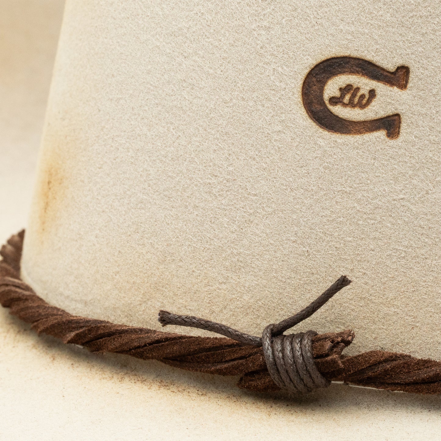 Cowboy hat with horseshoe logo