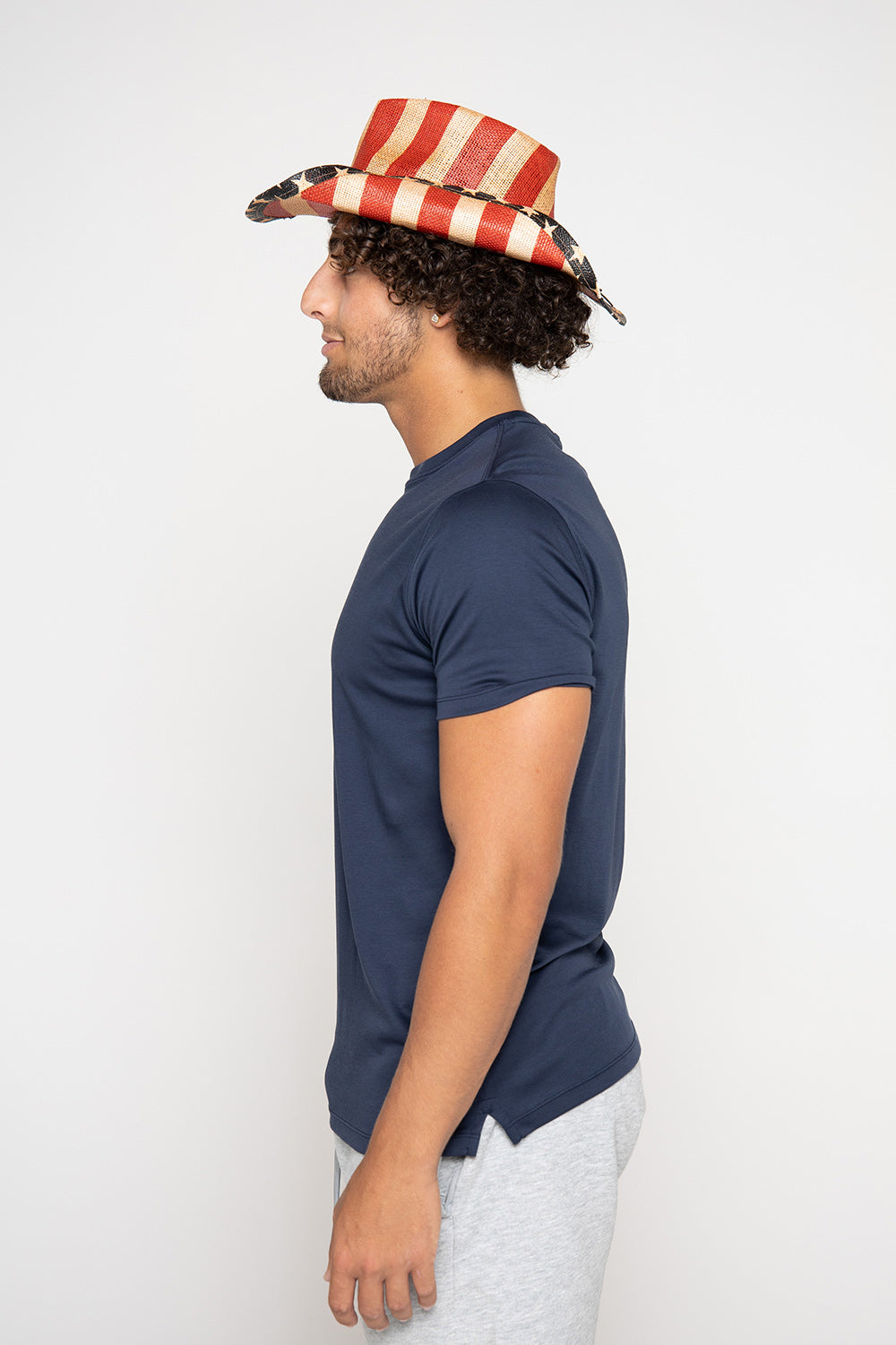 Man in blue shirt and American flag hat