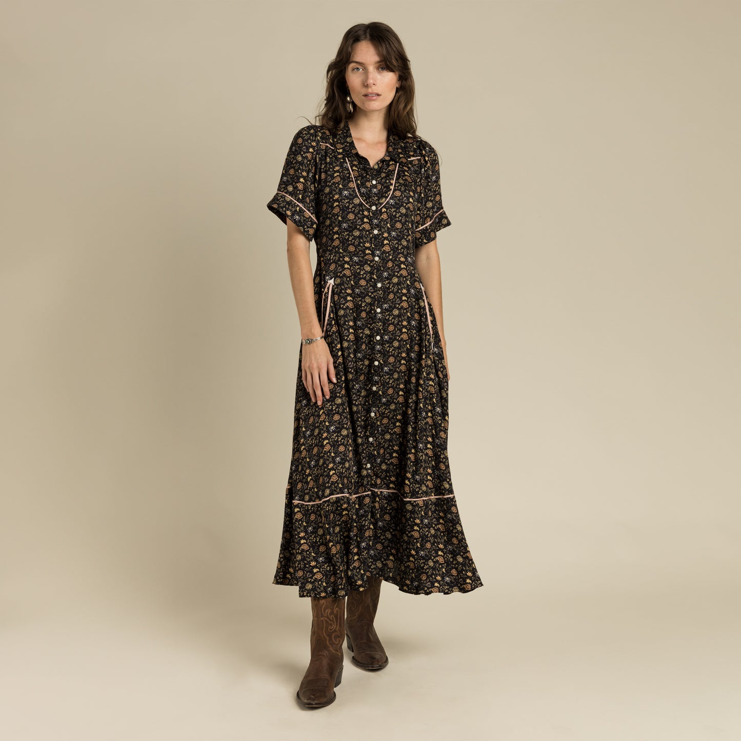 Woman wearing floral midi dress and boots