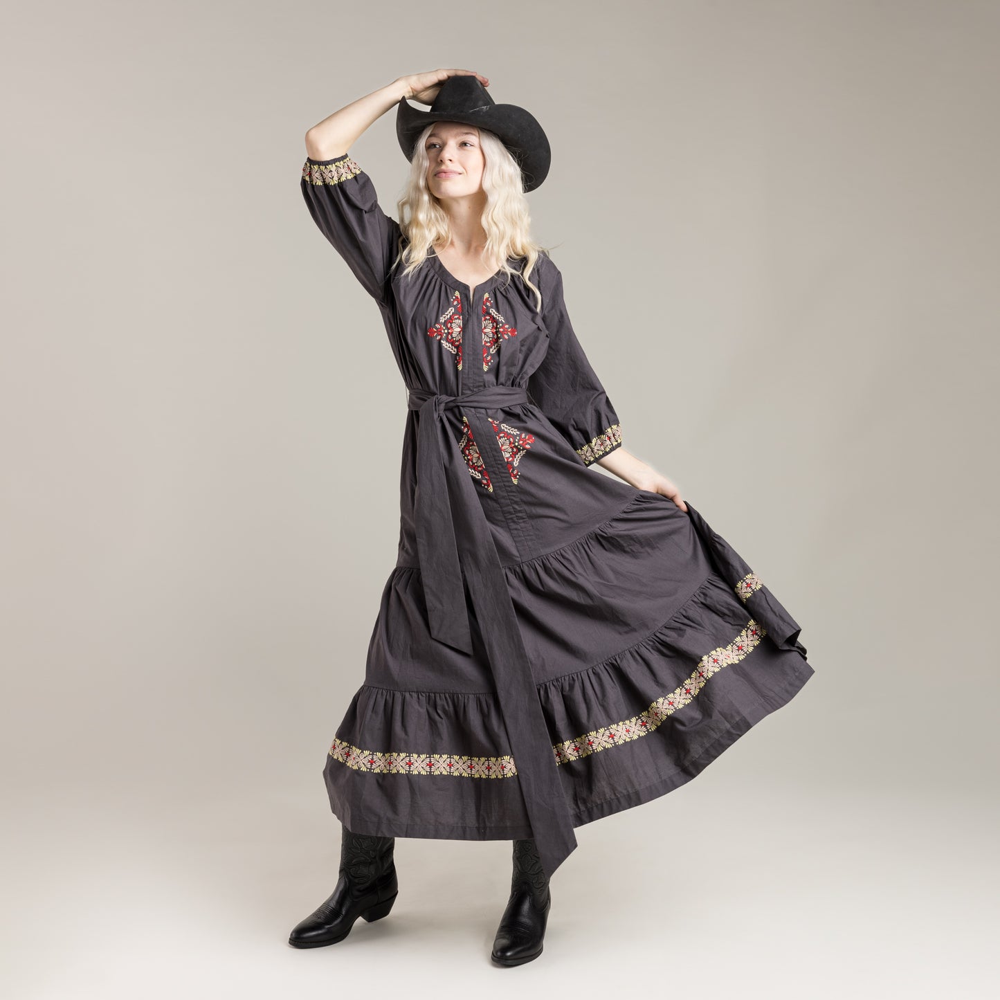 Woman in embroidered dress and hat