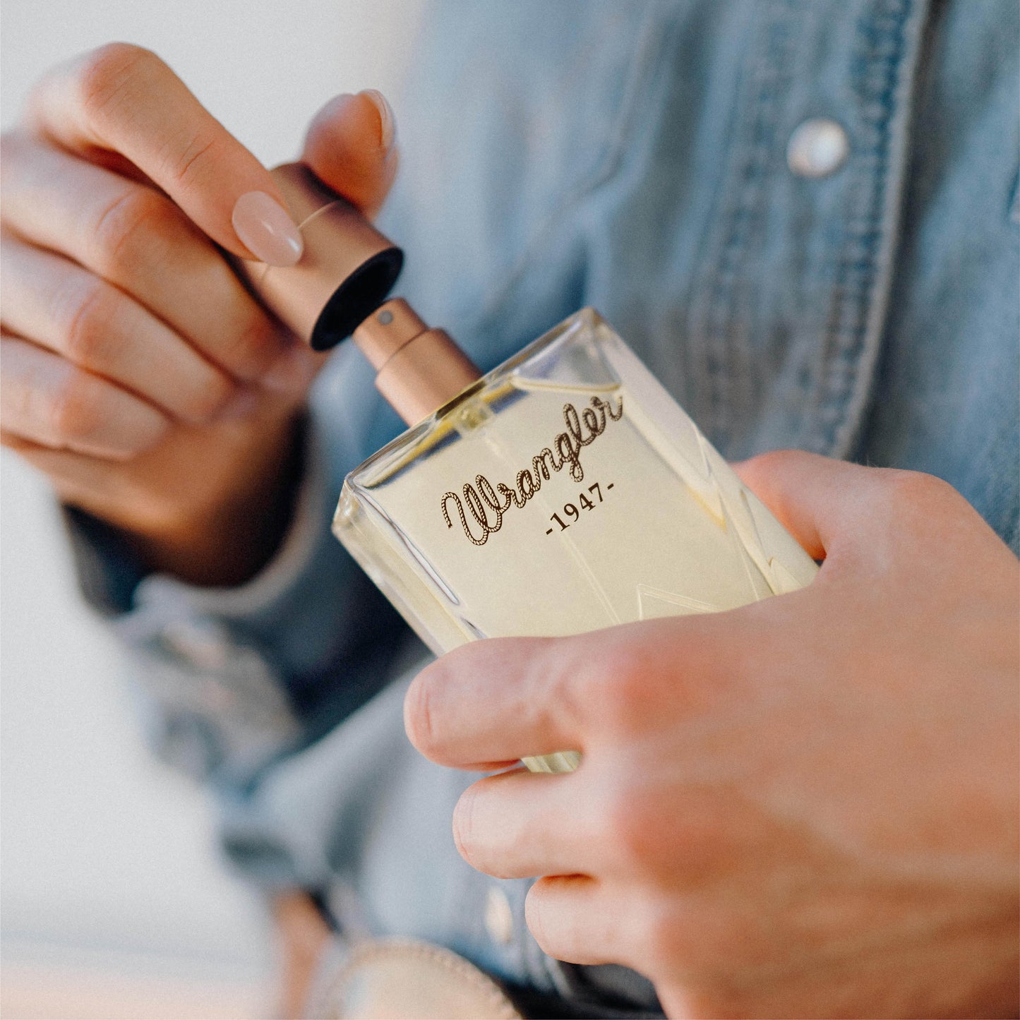 Wrangler cologne bottle being opened