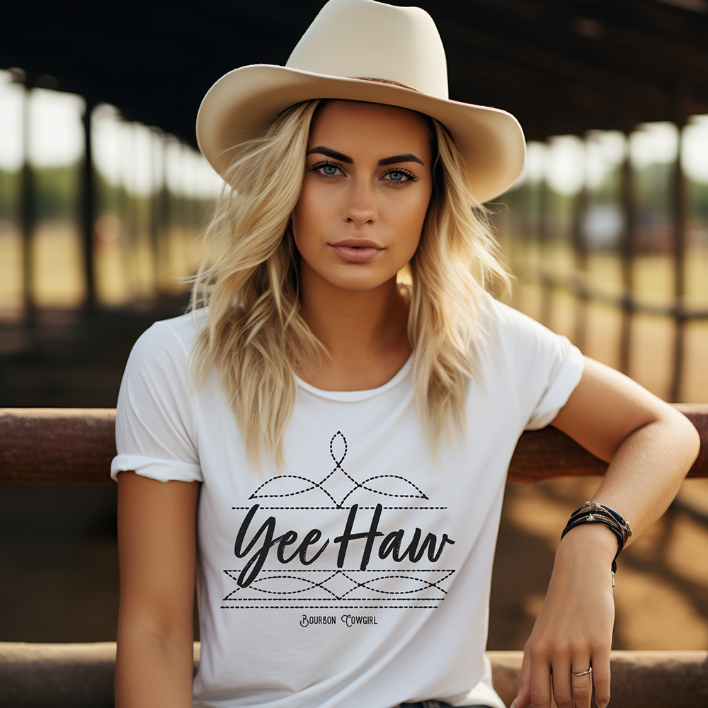 Woman in Yee Haw shirt and cowboy hat
