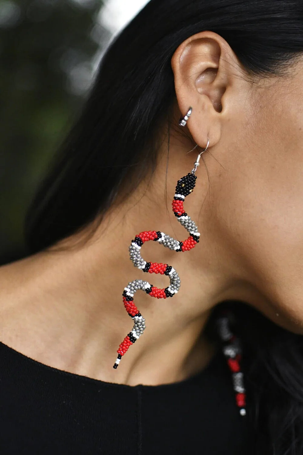 Zelda snake earrings on woman