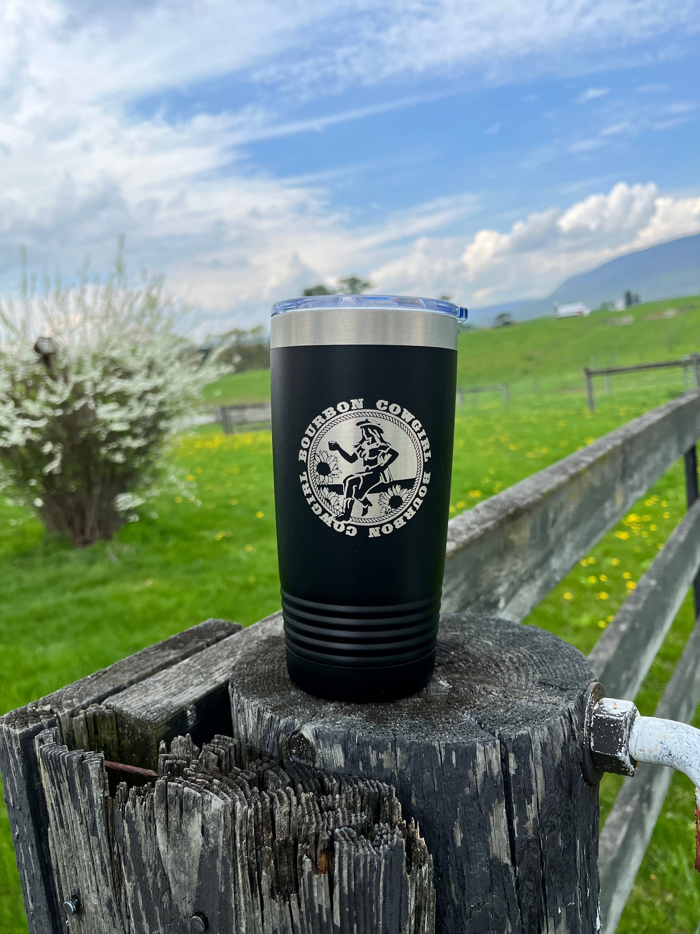 Black tumbler with Bourbon Cowgirl logo.