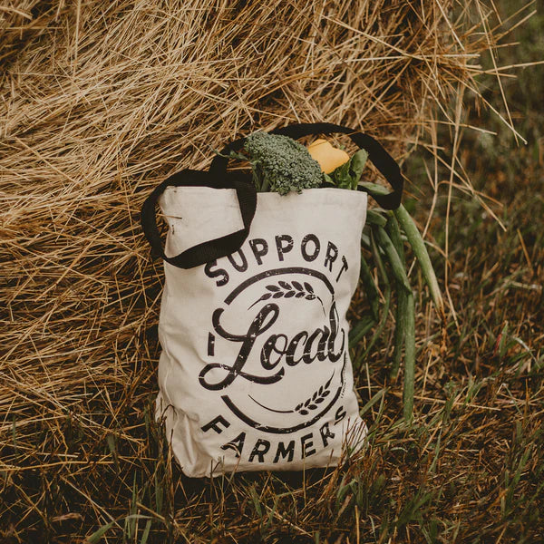 Tote bag with Support Local Farmers filled with produce