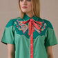 Woman in Just Wing It Dress with bow and embroidery