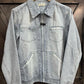 Light blue denim jacket with zipper.