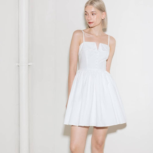 Woman wearing a white summer dress.