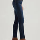 Woman wearing dark blue jeans and brown boots.
