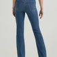 Woman wearing blue denim flared jeans.