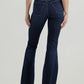 Woman wearing dark wash flared jeans.