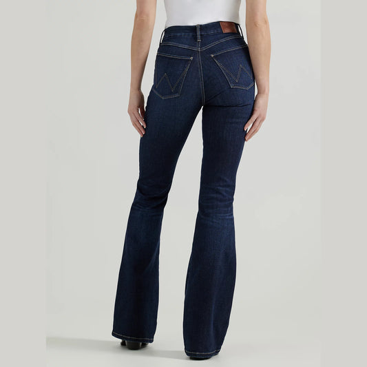 Woman wearing dark blue flared jeans.