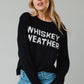Woman in black sweater with Whiskey Weather text.