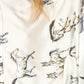Woman wearing a white shirt with horse print.