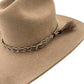 Tan cowboy hat with braided band.