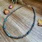 Turquoise beaded necklace on wood, 2C0FC7AB-6B1C