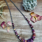 Purple stone necklace with cactus on wood