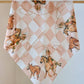 Bandana with cowboy print.