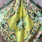 Yellow and green floral silk scarf.