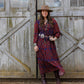 Amherst Dress woman in front of barn