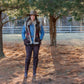 Woman in Chateau Vest and hat outdoors.