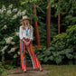 Woman in Winnie shirt and Lyla pants in garden
