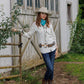 Woman in Rebel Shirt, jeans, and cowboy boots.