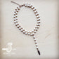 White beaded necklace with feather charm.