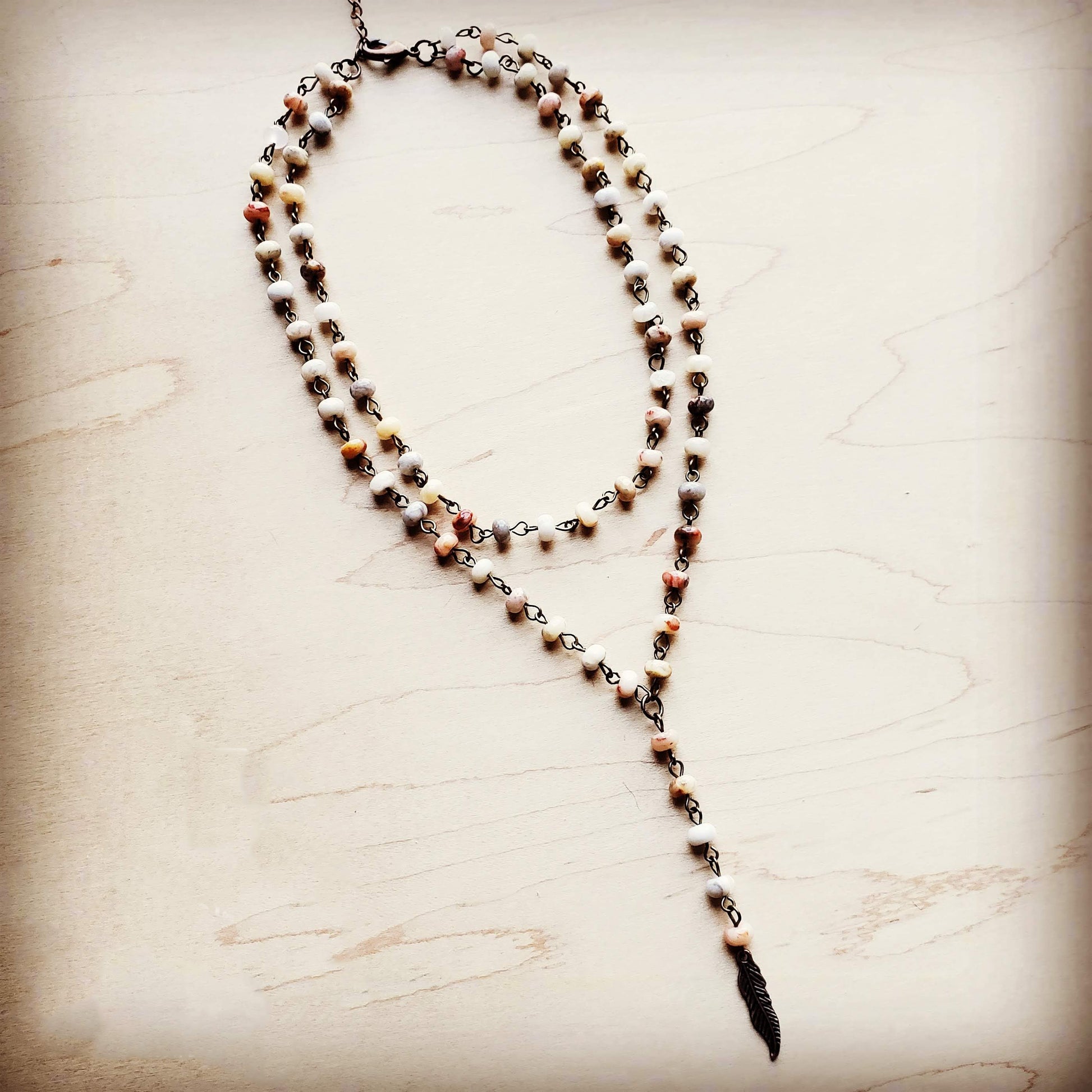 Boho layered necklace with feather charm