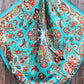 Turquoise floral scarf with paisley pattern