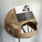 Tan mesh trucker hat with tag.