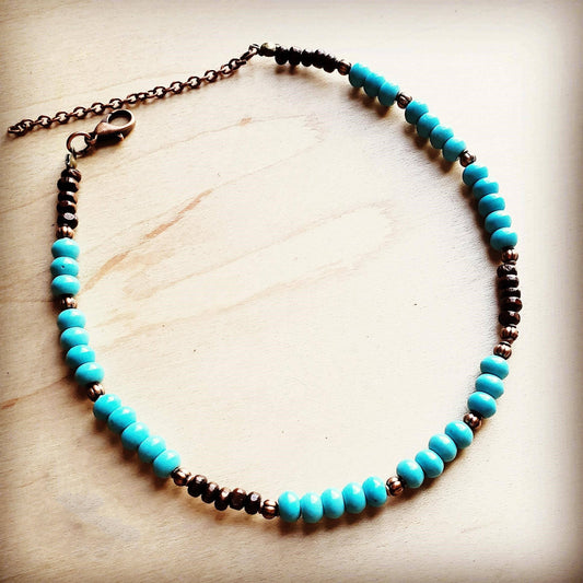 Turquoise beaded bracelet with copper accents