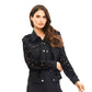 Woman wearing black floral denim jacket