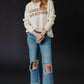 Woman in jeans and sweater