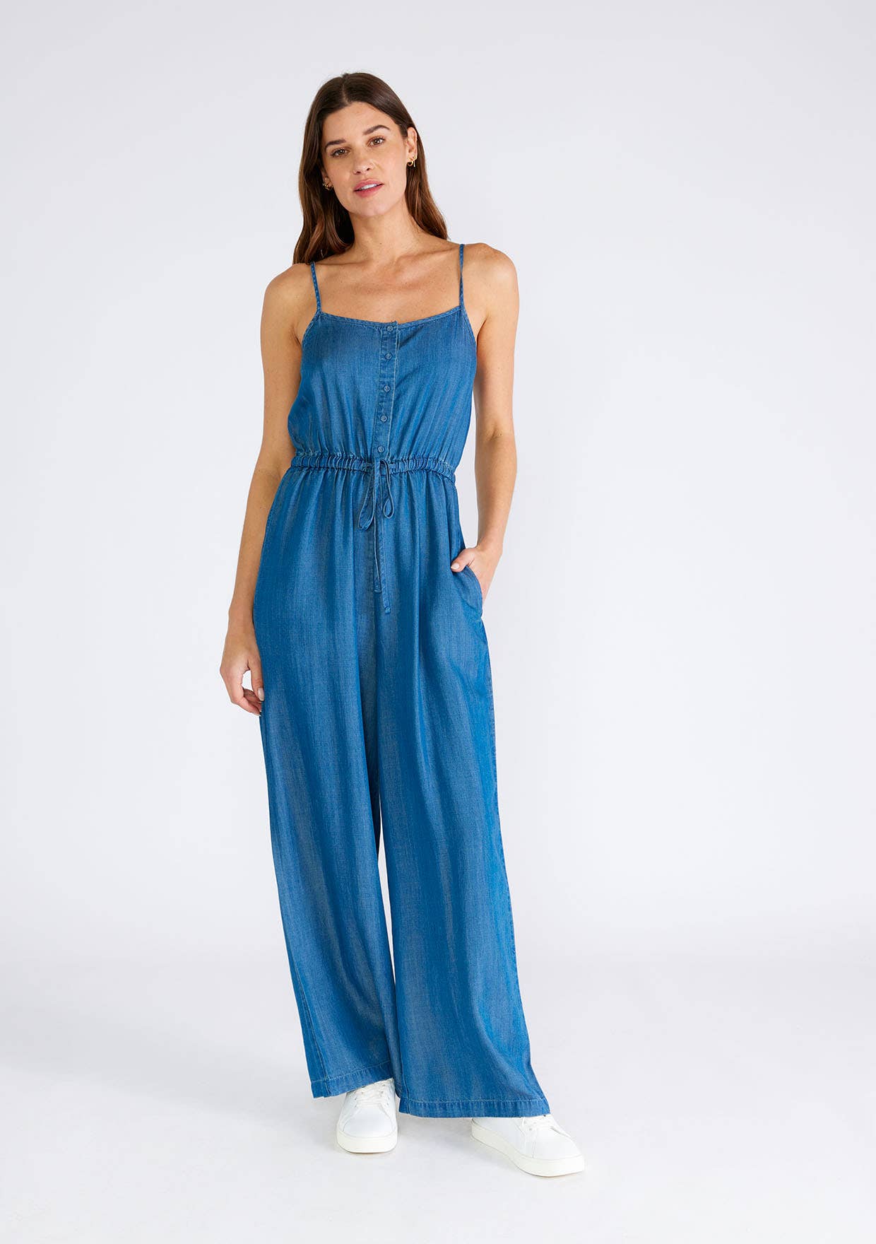 Woman in denim jumpsuit