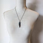 Feather necklace on mannequin