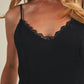 Woman wearing a black camisole with lace trim.