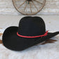 Black cowboy hat with red band.